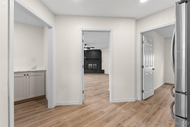 524 W 18th, Ada, OK 74820 - hall with baseboards and light wood finished floors