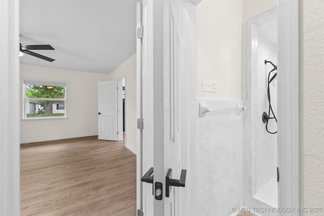 524 W 18th, Ada, OK 74820 - bathroom featuring a ceiling fan and wood finished floors