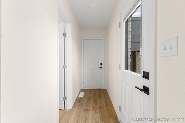 524 W 18th, Ada, OK 74820 - hall featuring light wood-style floors and baseboards