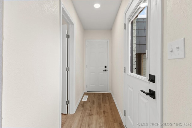 524 W 18th, Ada, OK 74820 - hallway with light wood-type flooring and baseboards