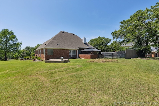 1631 Augusta, Ada, OK 74820 - back of property featuring a patio, a gazebo, brick siding, and a chimney
