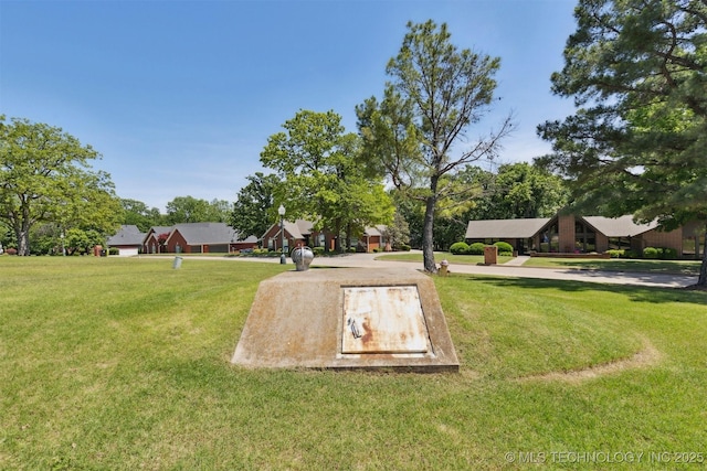 1631 Augusta, Ada, OK 74820 - entry to storm shelter with a lawn
