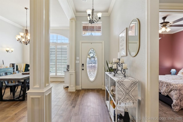 1631 Augusta, Ada, OK 74820 - foyer featuring a chandelier, ornamental molding, a ceiling fan, and light wood-style floors