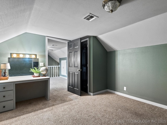 324 2019th Rd, Bartlesville, OK 74003 - office space featuring lofted ceiling, carpet floors, a textured ceiling, and baseboards