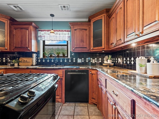 324 2019th Rd, Bartlesville, OK 74003 - kitchen featuring black appliances, a sink, dark stone counters, and backsplash