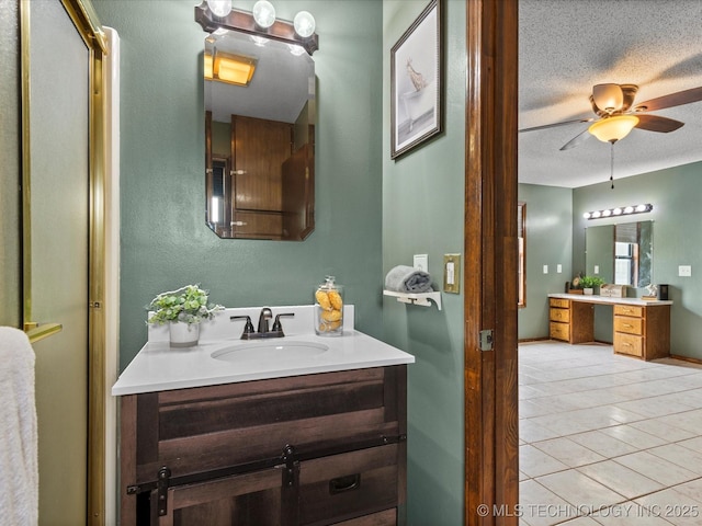 324 2019th Rd, Bartlesville, OK 74003 - bathroom featuring a textured ceiling, vanity, tile patterned floors, and a ceiling fan