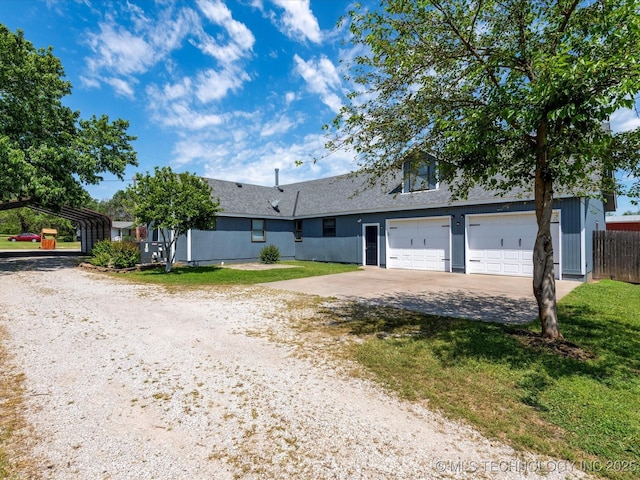 324 2019th Rd, Bartlesville, OK 74003 - view of front of home with driveway and a detached carport