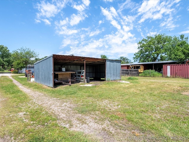 324 2019th Rd, Bartlesville, OK 74003 - view of pole building with a detached carport, a yard, and driveway