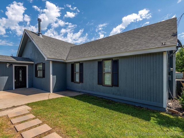 324 2019th Rd, Bartlesville, OK 74003 - view of front of property with roof with shingles, a front yard, and a patio area