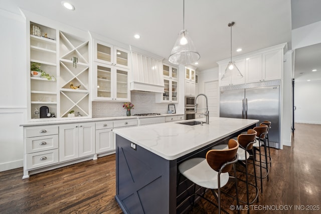 1038 E 38th Pl, Tulsa, OK 74105 - kitchen featuring built in appliances, dark wood-type flooring, white cabinetry, and recessed lighting