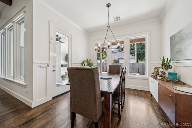 1038 E 38th Pl, Tulsa, OK 74105 - dining space featuring dark wood-style floors, a chandelier, and ornamental molding