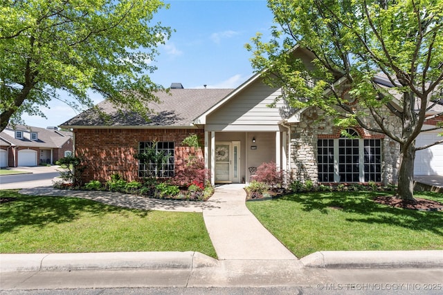 7724 S 83rd E Ave, Tulsa, OK 74133 - view of front facade featuring a front lawn, brick siding, and stone siding