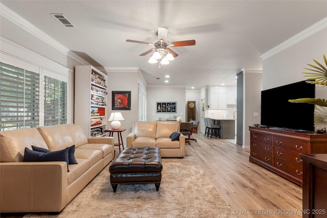 7724 S 83rd E Ave, Tulsa, OK 74133 - living room featuring ceiling fan, light wood-style flooring, crown molding, and recessed lighting