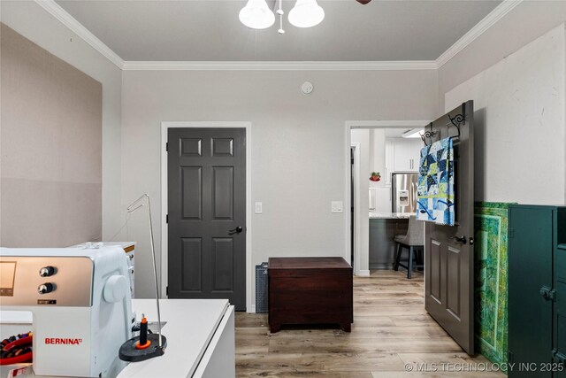 7724 S 83rd E Ave, Tulsa, OK 74133 - laundry room featuring ornamental molding and wood finished floors