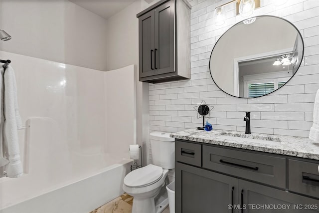 7724 S 83rd E Ave, Tulsa, OK 74133 - full bathroom featuring vanity, toilet, decorative backsplash, and washtub / shower combination