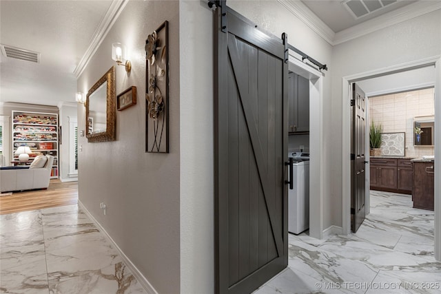 7724 S 83rd E Ave, Tulsa, OK 74133 - corridor featuring a barn door, ornamental molding, light marble finish floors, and baseboards