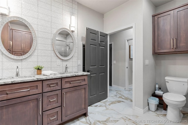 7724 S 83rd E Ave, Tulsa, OK 74133 - bathroom with marble look tile flooring, double vanity, baseboards, toilet, and decorative backsplash