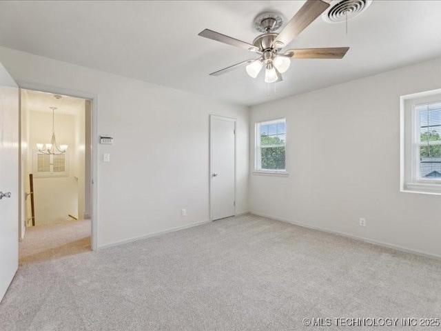 5339 S 32nd W Ave, Tulsa, OK 74107 - unfurnished bedroom with carpet floors, multiple windows, a chandelier, and baseboards