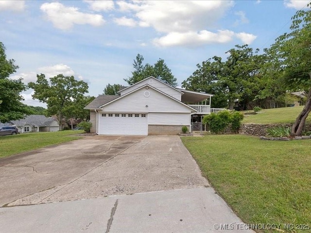 5339 S 32nd W Ave, Tulsa, OK 74107 - view of front of property featuring a front yard, an attached garage, concrete driveway, and brick siding