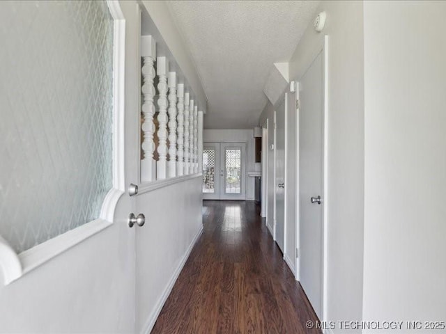 5339 S 32nd W Ave, Tulsa, OK 74107 - hallway with wood finished floors, french doors, baseboards, and a textured ceiling