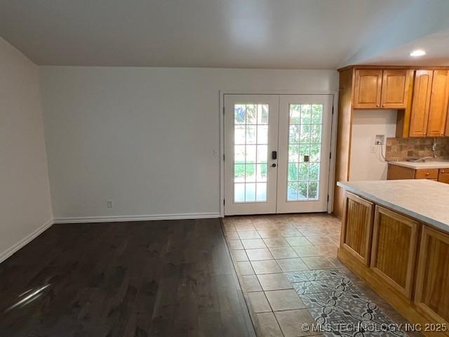 1800 N 26th St, Broken Arrow, OK 74014 - doorway to outside featuring french doors, baseboards, and wood finished floors