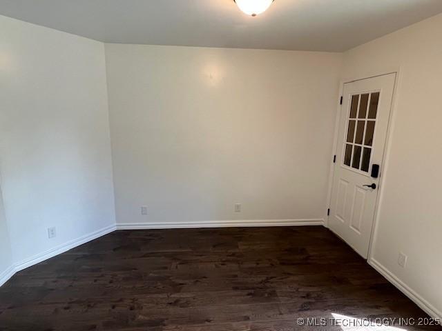 1800 N 26th St, Broken Arrow, OK 74014 - spare room featuring dark wood-style flooring and baseboards