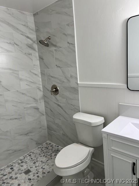 1800 N 26th St, Broken Arrow, OK 74014 - bathroom with a stall shower, vanity, wainscoting, and toilet