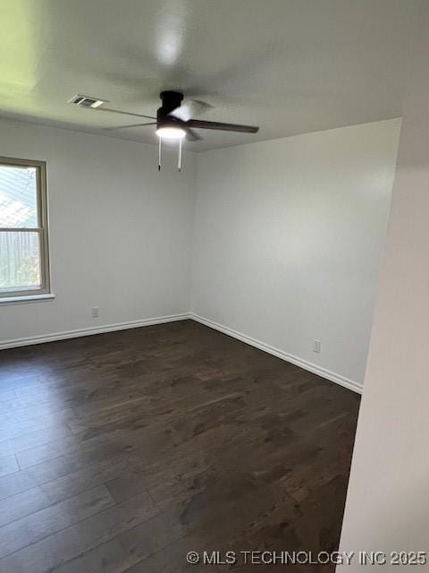 1800 N 26th St, Broken Arrow, OK 74014 - empty room with a ceiling fan, dark wood-style floors, and baseboards