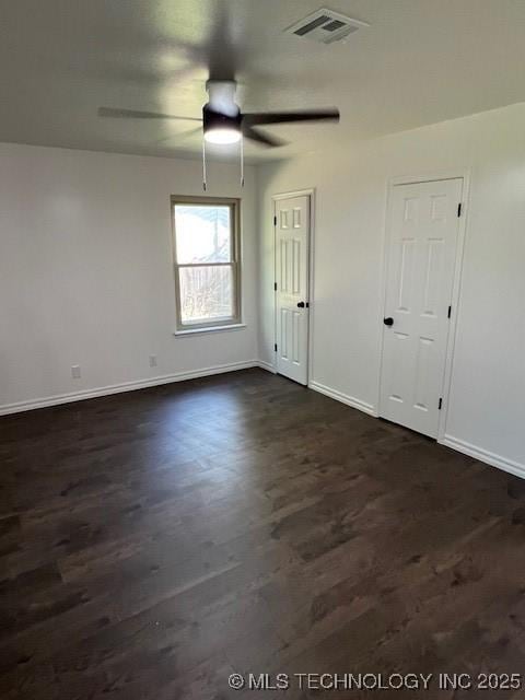 1800 N 26th St, Broken Arrow, OK 74014 - spare room featuring baseboards, dark wood-style floors, and ceiling fan