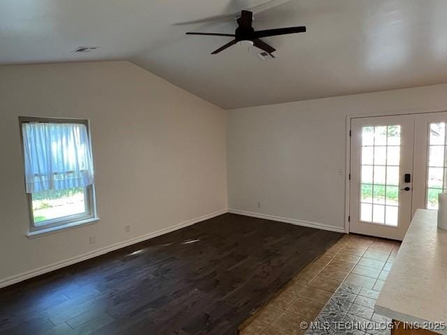 1800 N 26th St, Broken Arrow, OK 74014 - unfurnished room featuring lofted ceiling, a ceiling fan, french doors, wood finished floors, and baseboards