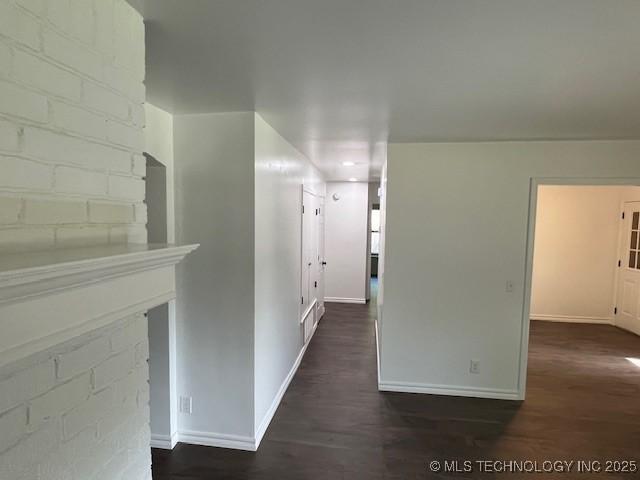 1800 N 26th St, Broken Arrow, OK 74014 - corridor with baseboards and dark wood-type flooring