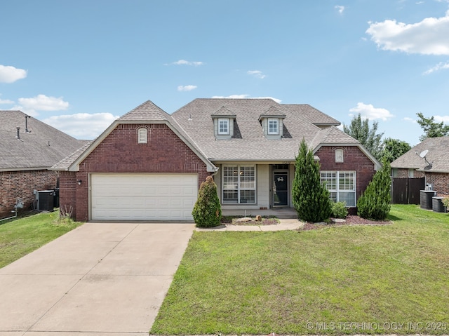 11210 N 131st E Pl, Owasso, OK 74055 - view of front of house with central AC unit, a garage, driveway, and brick siding