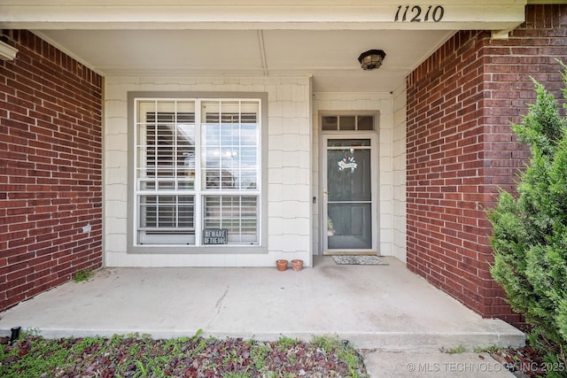 11210 N 131st E Pl, Owasso, OK 74055 - entrance to property with covered porch and brick siding
