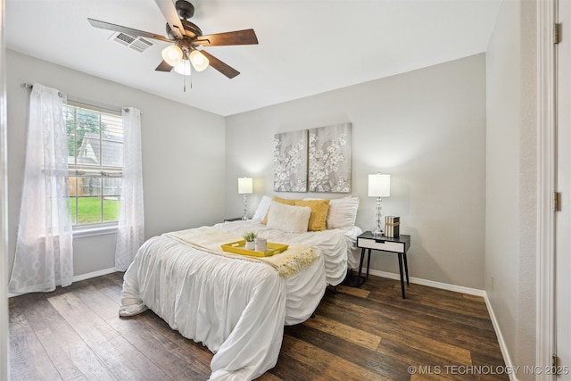 5144 S 34th W Ave, Tulsa, OK 74107 - bedroom featuring dark wood-type flooring, baseboards, and ceiling fan