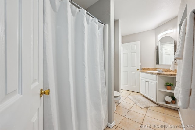 5144 S 34th W Ave, Tulsa, OK 74107 - full bath with toilet, tile patterned floors, vanity, and a shower with curtain