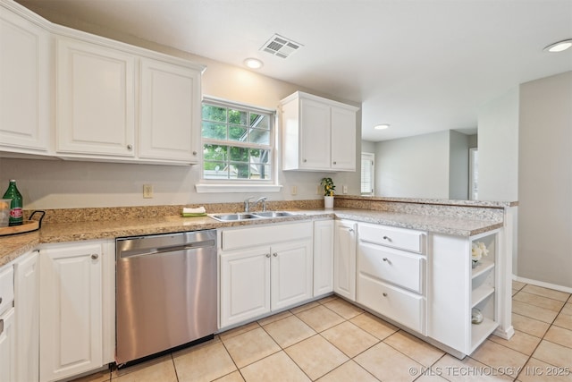 5144 S 34th W Ave, Tulsa, OK 74107 - kitchen featuring dishwasher, a sink, light tile patterned flooring, white cabinets, and a peninsula