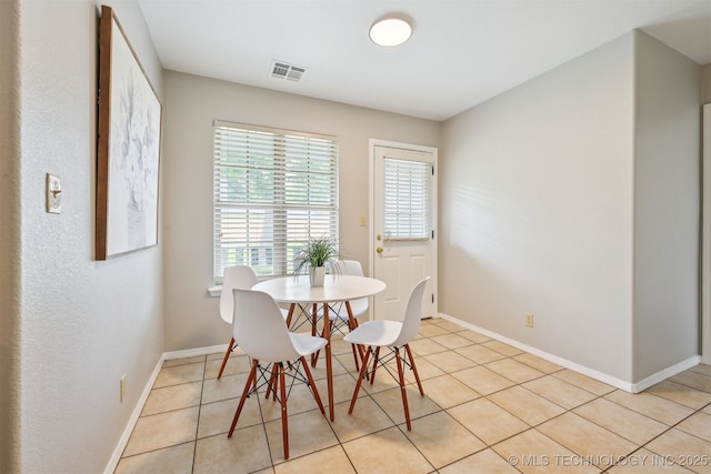 5144 S 34th W Ave, Tulsa, OK 74107 - dining space with light tile patterned floors and baseboards