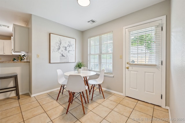 5144 S 34th W Ave, Tulsa, OK 74107 - dining area featuring baseboards and light tile patterned floors