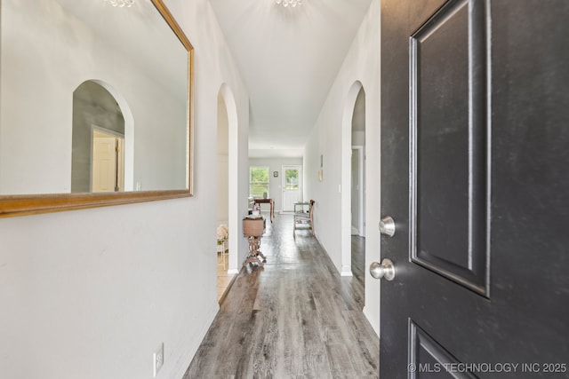 1309 W Missouri Ave, Claremore, OK 74019 - foyer with wood finished floors, baseboards, and arched walkways