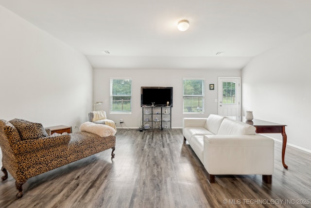 1309 W Missouri Ave, Claremore, OK 74019 - living room featuring wood finished floors, baseboards, and lofted ceiling