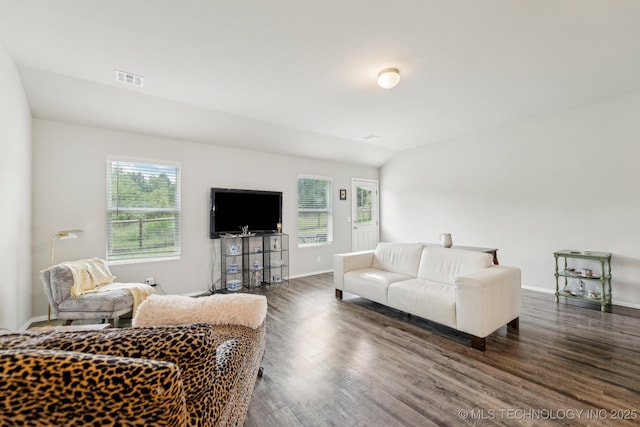 1309 W Missouri Ave, Claremore, OK 74019 - living room with plenty of natural light, baseboards, wood finished floors, and lofted ceiling