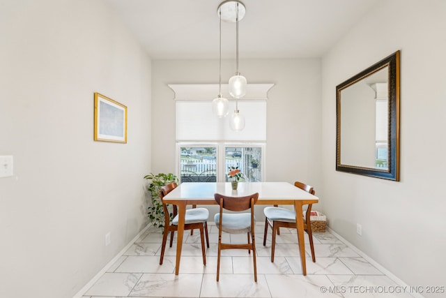 1309 W Missouri Ave, Claremore, OK 74019 - dining room with light marble finish flooring and baseboards