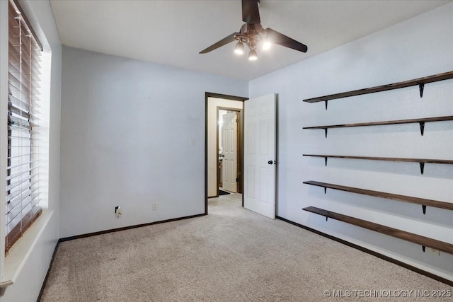 211 Meadowlark, Durant, OK 74701 - unfurnished bedroom with carpet, baseboards, and ceiling fan