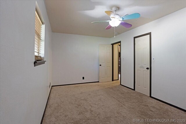 211 Meadowlark, Durant, OK 74701 - unfurnished bedroom featuring carpet, baseboards, and a ceiling fan