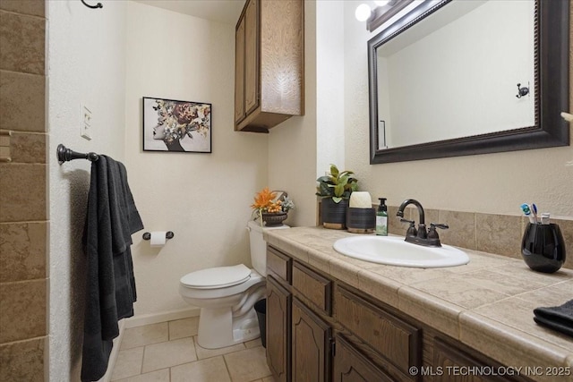 211 Meadowlark, Durant, OK 74701 - bathroom featuring toilet, vanity, tile patterned flooring, and baseboards