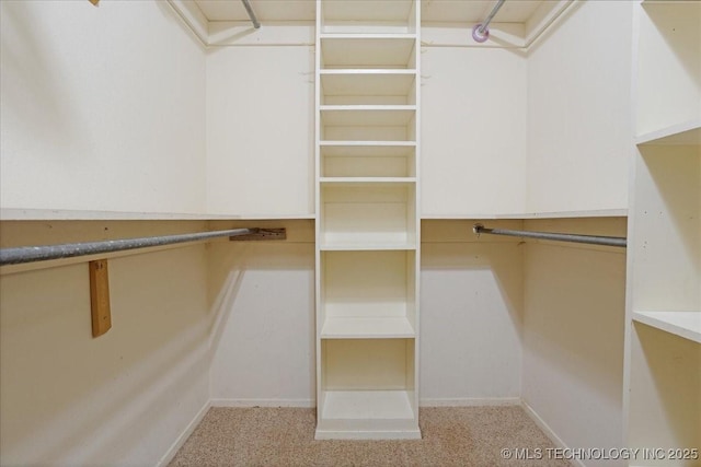211 Meadowlark, Durant, OK 74701 - walk in closet featuring carpet