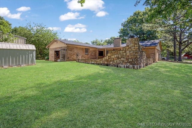 211 Meadowlark, Durant, OK 74701 - view of green lawn featuring an outbuilding
