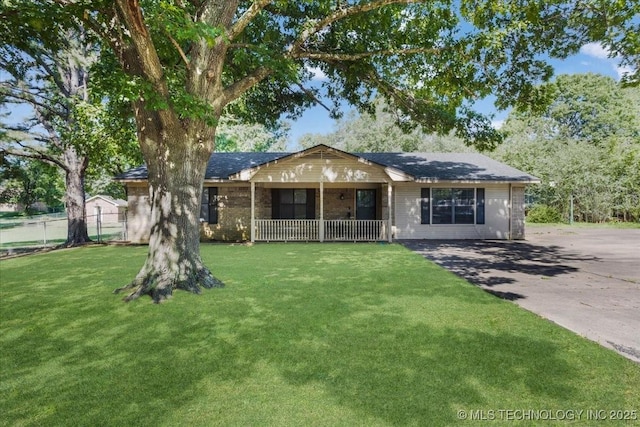 211 Meadowlark, Durant, OK 74701 - single story home with covered porch and driveway