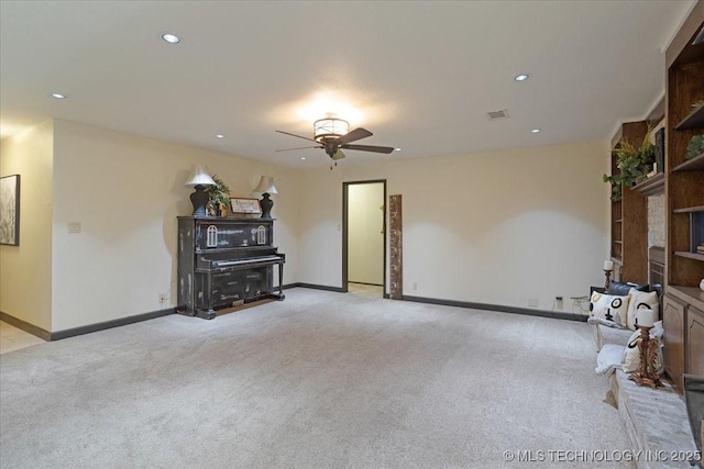 211 Meadowlark, Durant, OK 74701 - unfurnished living room with light carpet, ceiling fan, baseboards, recessed lighting, and a wood stove