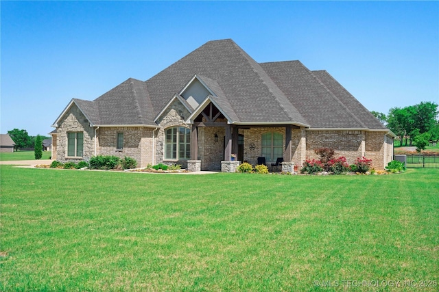 1580 Dawson Dr, Fort Gibson, OK 74434 - view of front of house featuring a front lawn, brick siding, and roof with shingles